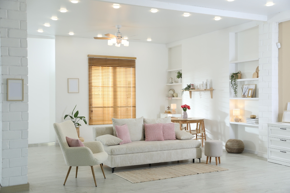 open concept living room divided into zones using lighting and furniture arrangement