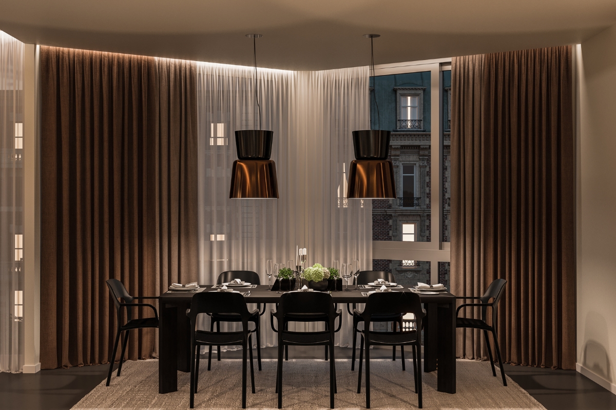 Sculptural pendant light above dining table creating layered lighting and cozy mood for 2026 tren