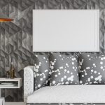 Layered wall with wooden slats, plaster texture, and floating shelves in modern living room 2026