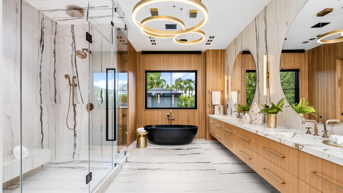 Luxury bathroom featuring marble countertops, layered lighting, and neutral color palette for modern style