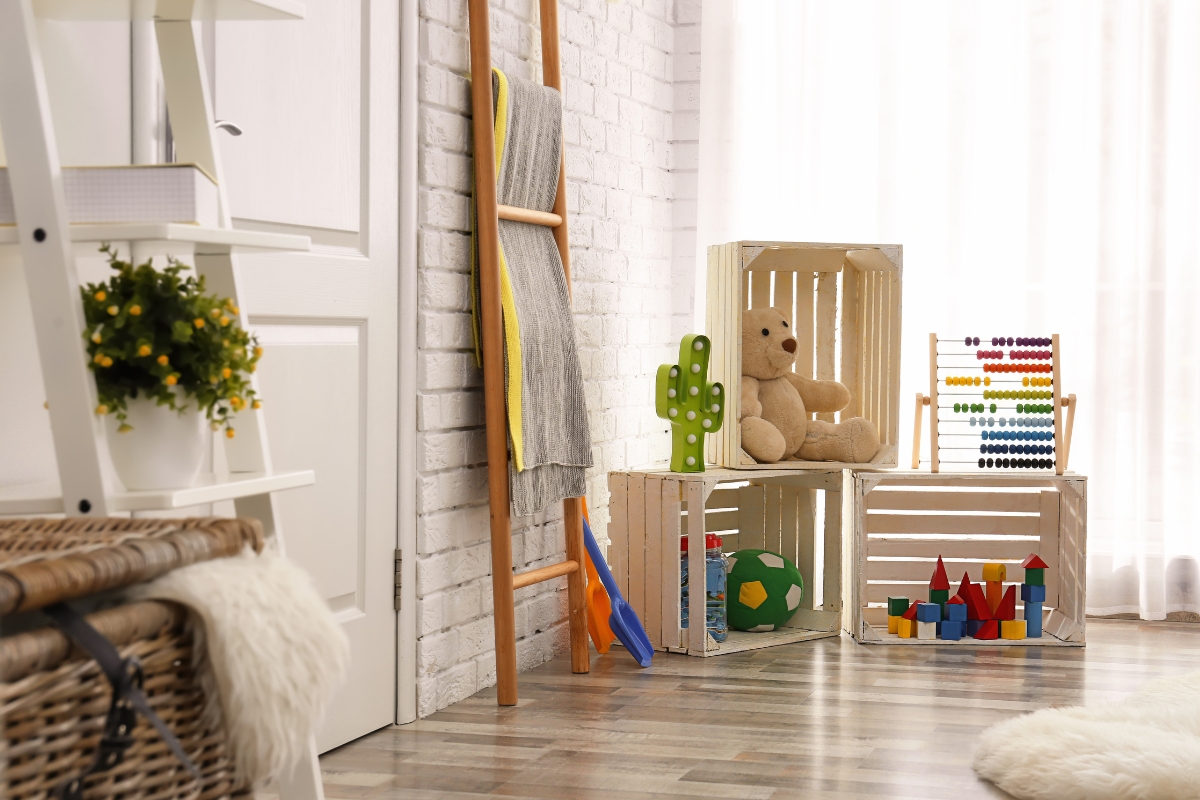 Kid-friendly storage bins and open shelves in a kids room