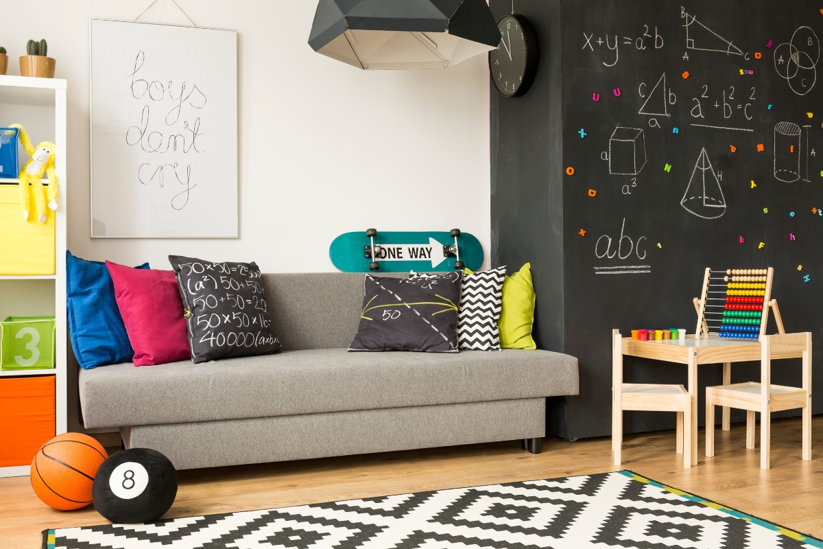 Kids play and creative space with art table and storage bins