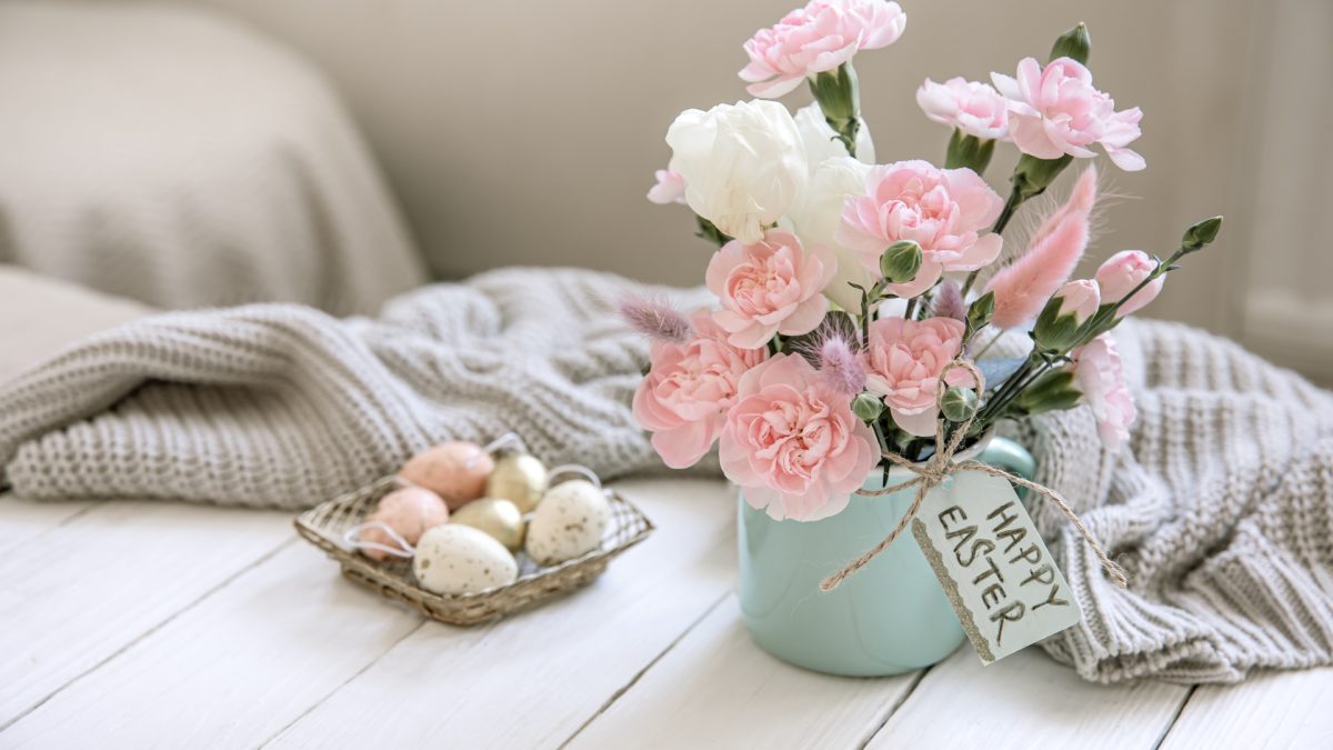 Living room styled with pastel cushions and fresh spring florals