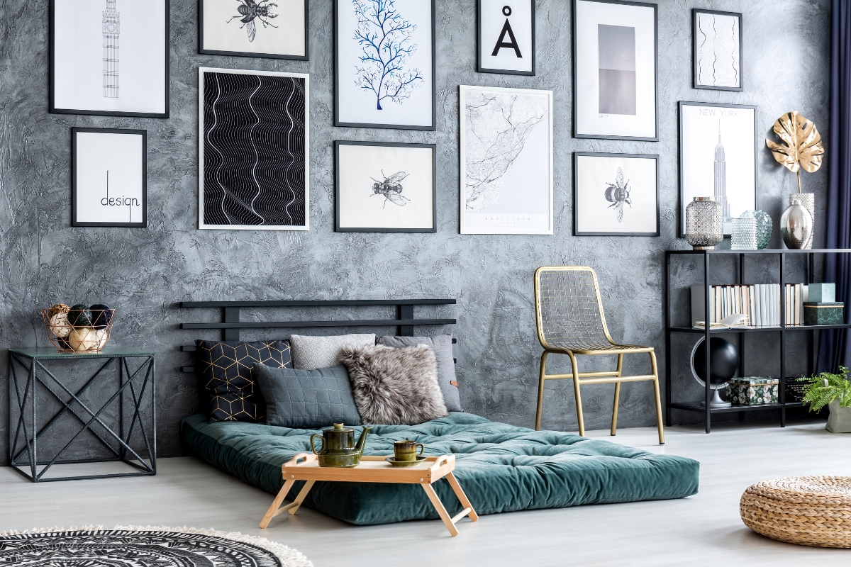 Black and white statement gallery wall arranged in modern living room 2026