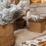 Living room decorated with cozy winter textiles, greenery, and candles for stylish decor that lasts beyond the holiday season.