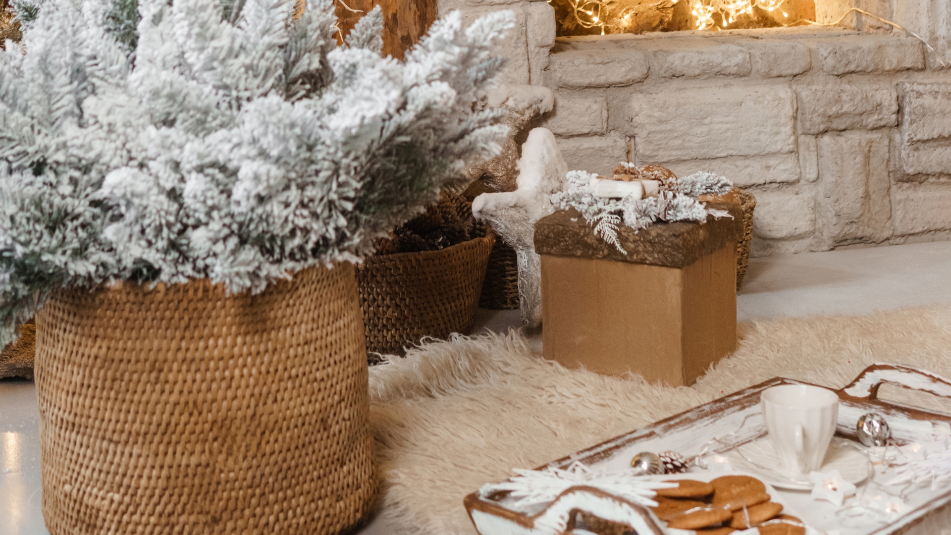 Living room decorated with cozy winter textiles, greenery, and candles for stylish decor that lasts beyond the holiday season.