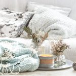 Summer living room with light linen fabrics and natural textures