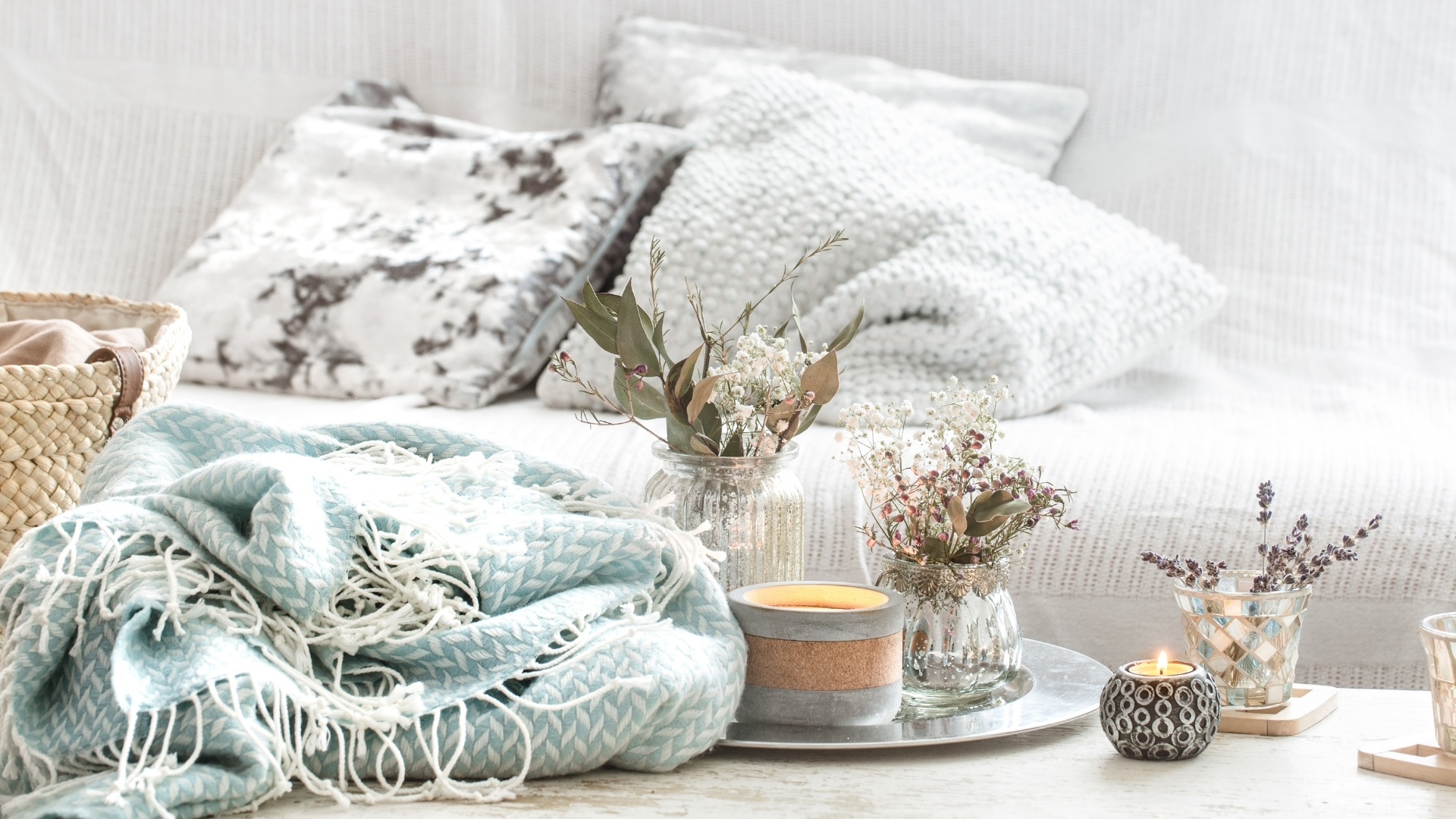 Summer living room with light linen fabrics and natural textures