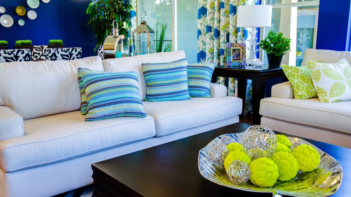 Living room with light textiles and vibrant summer accents