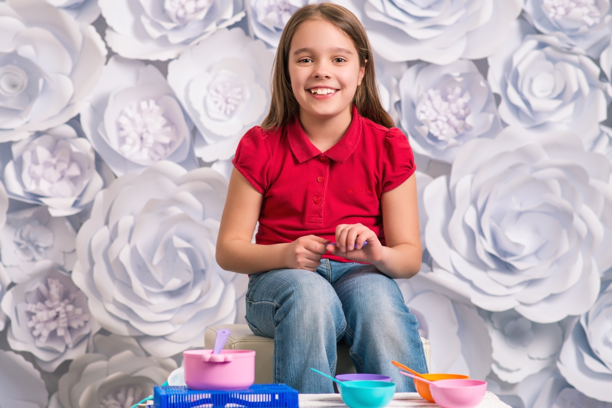 Modern living room with neutral walls highlighting a bold velvet statement sofa