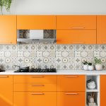 Kitchen accent wall painted in bold color with patterned backsplash creating a stylish, modern, and visually striking kitchen interior