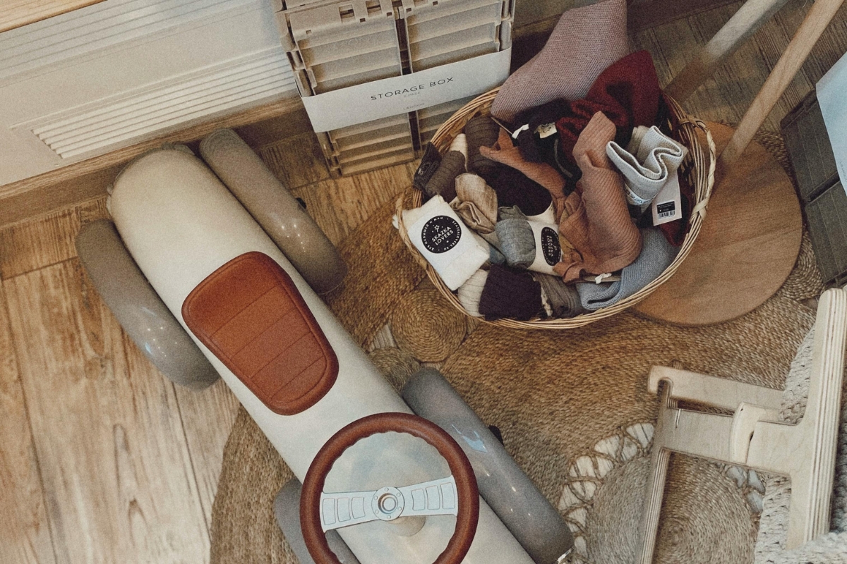 Cozy kids room with soft rugs, floor cushions, warm lighting, canopy corner, and sensory-friendly decor creating a calm and inviting atmosphere