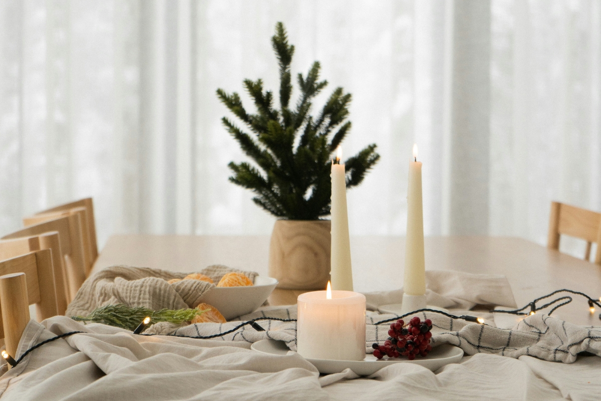 Winter living room styled with natural elements like wooden accents, bare branches, and greenery creating a calm, cozy, and elegant atmosphere after the holidays.