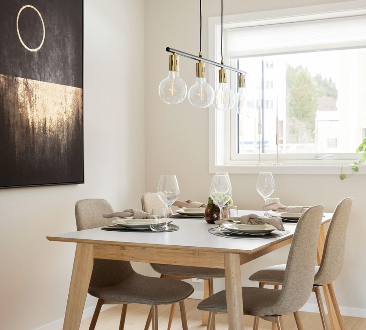 Arched doorway connecting dining area and kitchen in a small apartment, providing smooth transitions, improved flow, and stylish curved architecture.