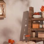 Cozy autumn living room with layered textiles, warm-toned cushions, wooden accents, and natural elements like dried flowers and baskets creating a welcoming fall interior.