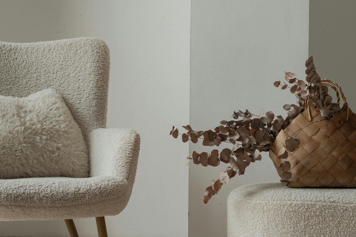 Velvet curved sofa in modern living room with soft texturesBouclé accent chair paired with round coffee table