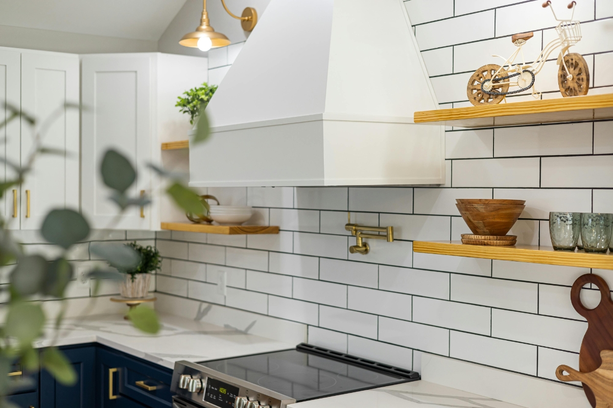 Kitchen accent wall with textured tiles behind stove area showing smart wall placement for a premium kitchen design