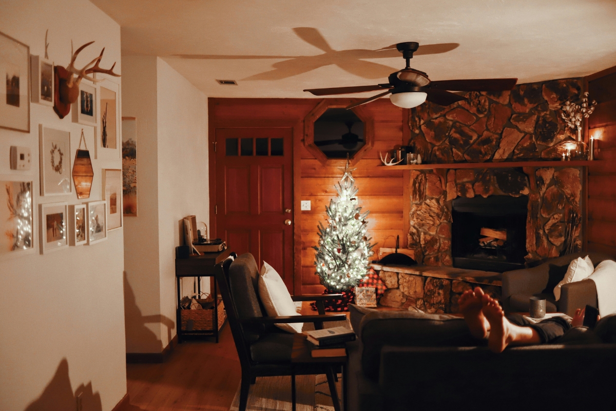 Bright living room being decluttered after the holidays with decorations removed, creating a clean, calm, and refreshed winter-ready space.