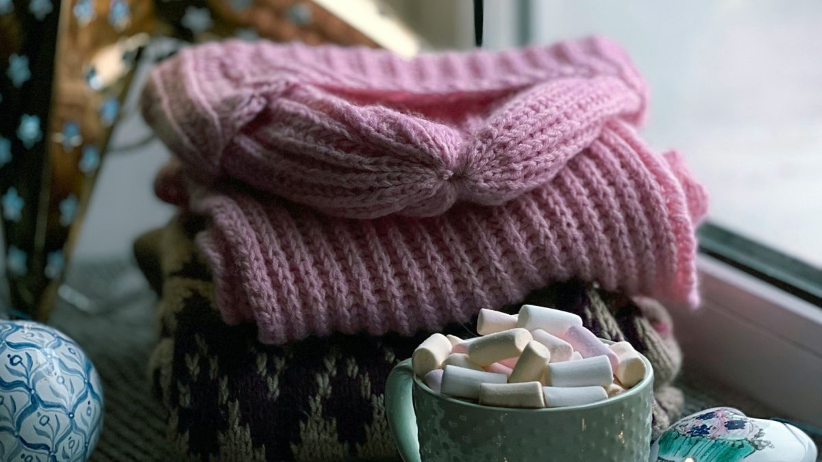 Cozy living room with layered throws and textured cushions for winter home styling