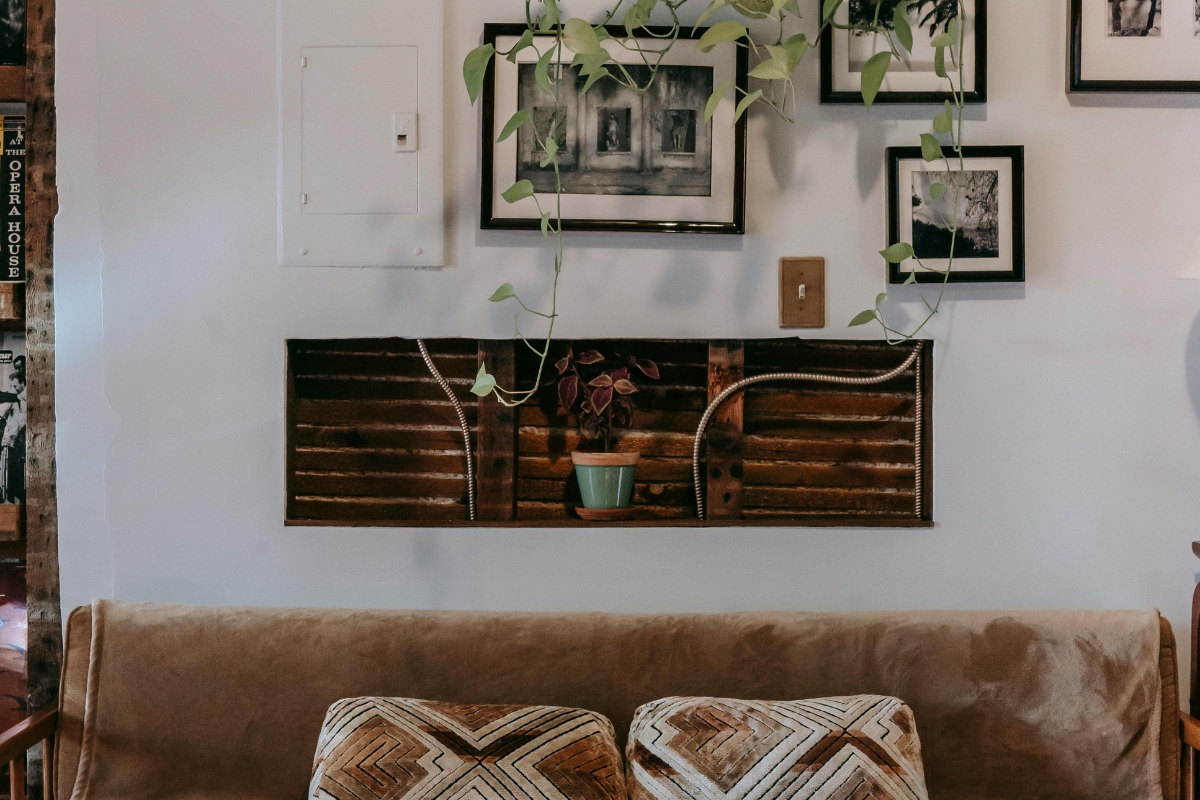 Relaxed living room with soft lighting, cozy seating, layered textures, and natural comfort-focused decor creating a warm lived-in fall atmosphere