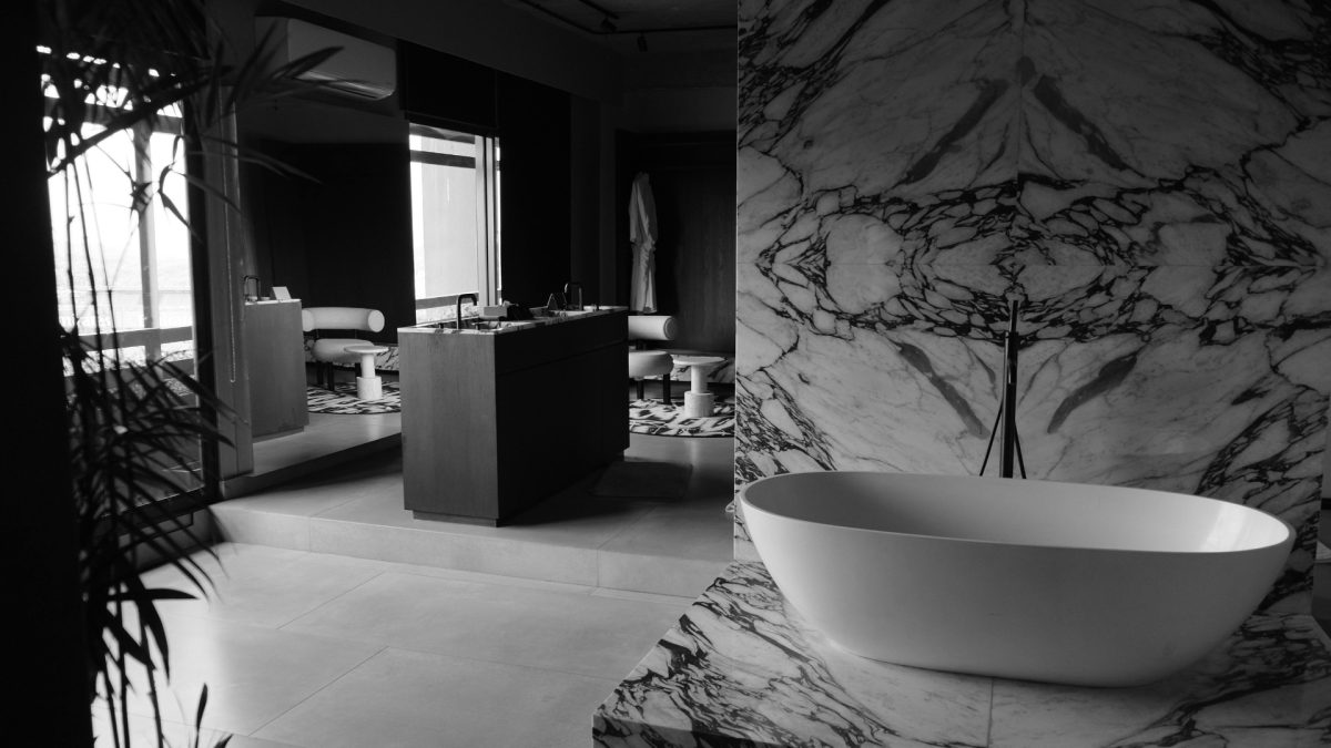 Compact luxury bathroom with modern vanity and elegant lighting in a small space