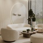 Curved sofa in modern living room with soft neutral decor Round coffee table styling in cozy contemporary interior