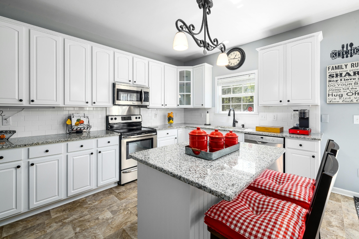 Kitchen accent wall with bold color and geometric patterned tiles, showing a stylish and visually striking kitchen wall design