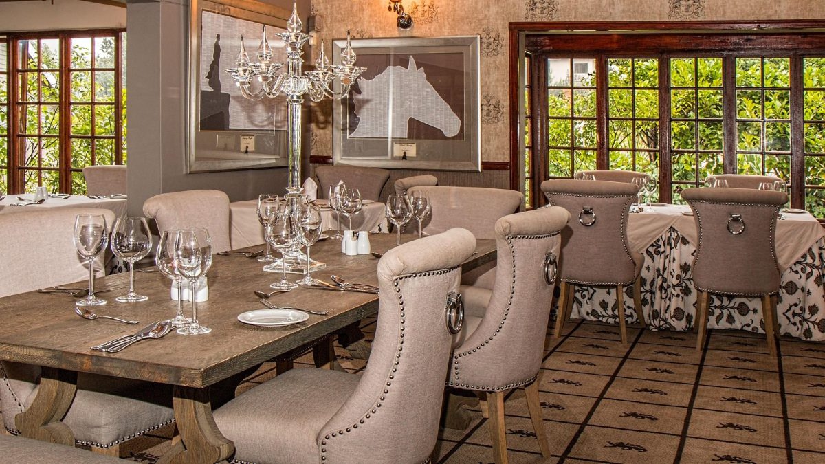 Modern dining room with wooden dining room table and upholstered chairs