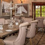 Modern dining room with wooden dining room table and upholstered chairs