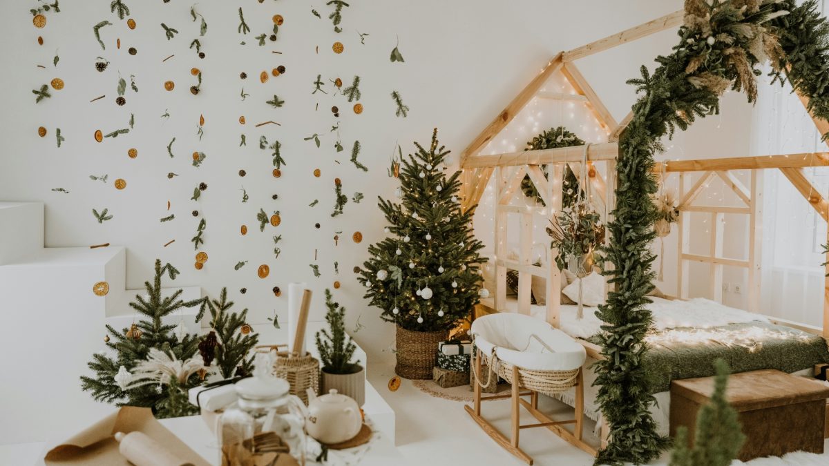 Living room styled for winter after Christmas with neutral tones, cozy throws, warm lighting, and minimal elegant decor creating a calm and inviting atmosphere.