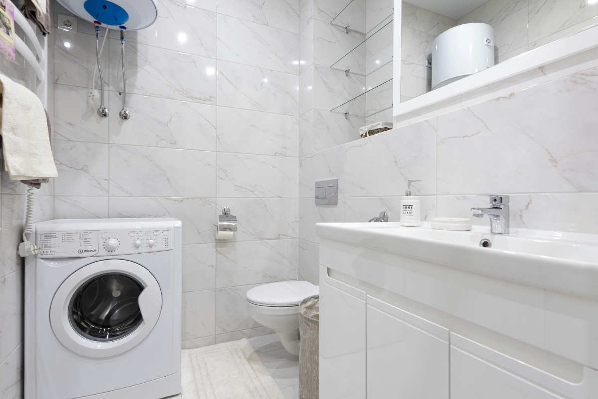 Minimal bathroom with hidden cabinets and floating shelves for smart storage