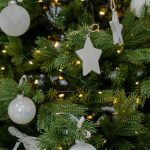 Elegant winter living room styled with neutral tones, soft textures, warm lighting, and minimal decor creating a calm space after holiday decorations are removed.