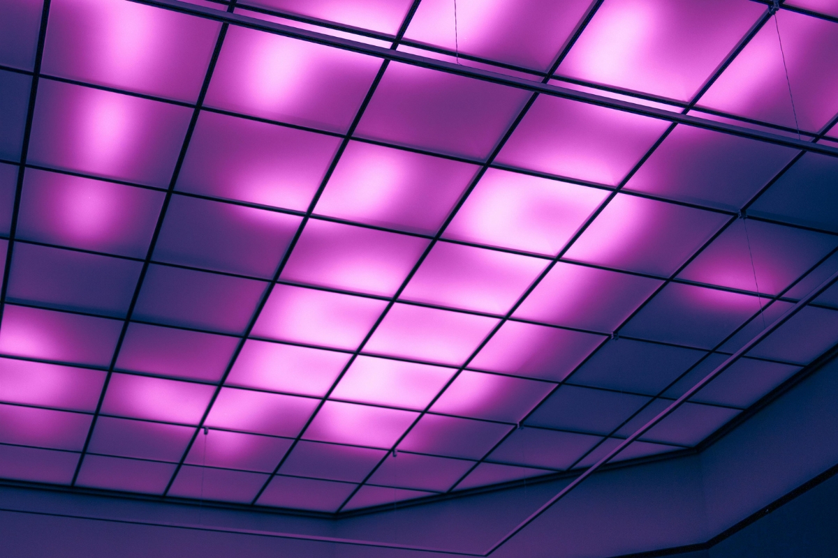 Hidden cove lighting creating a soft glow along modern layered ceiling