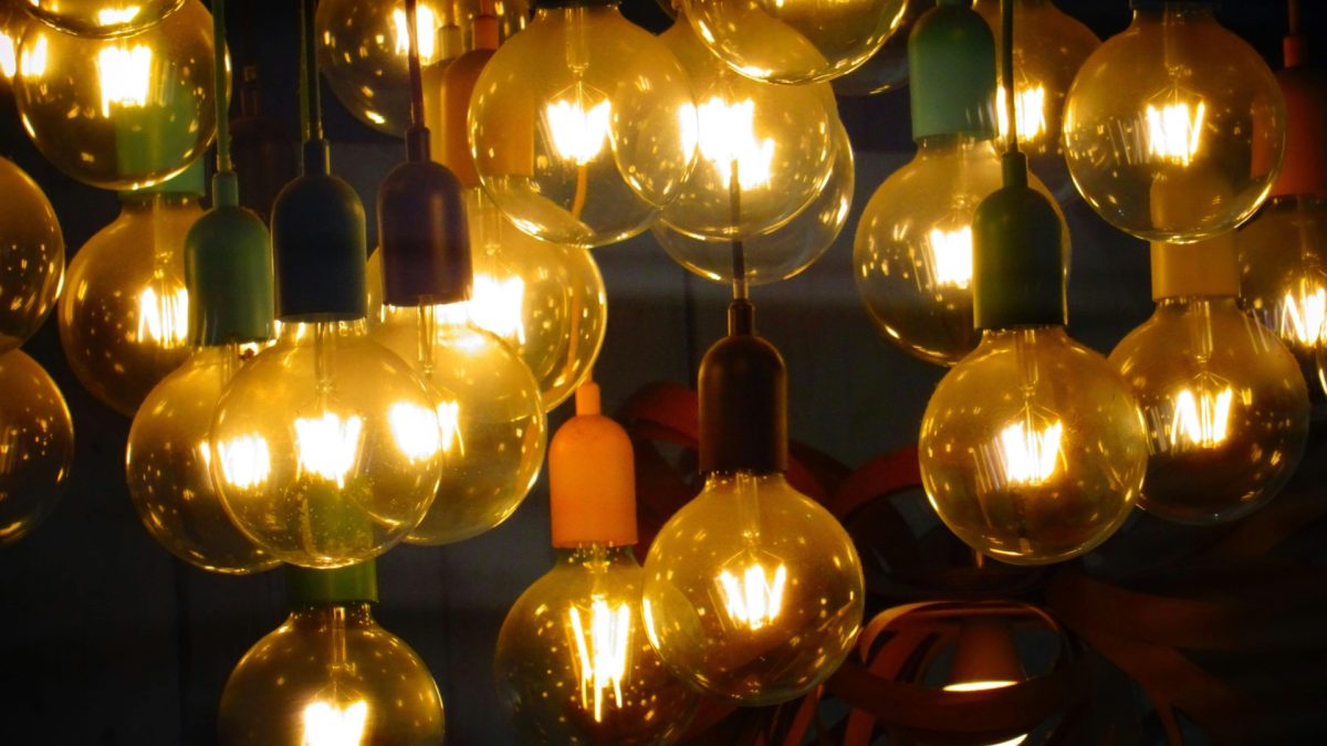 Soft indirect LED lighting behind TV unit creating a warm, modern home ambience with hidden lights and cozy interior decor.