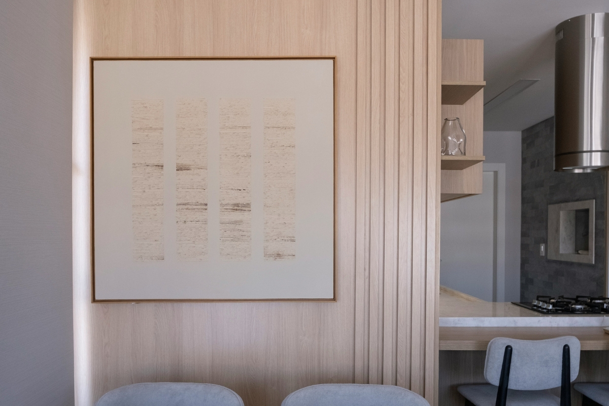 Functional kitchen wall with balanced arrangement of shelves, hooks, and decorative items creating an organized and stylish kitchen interior