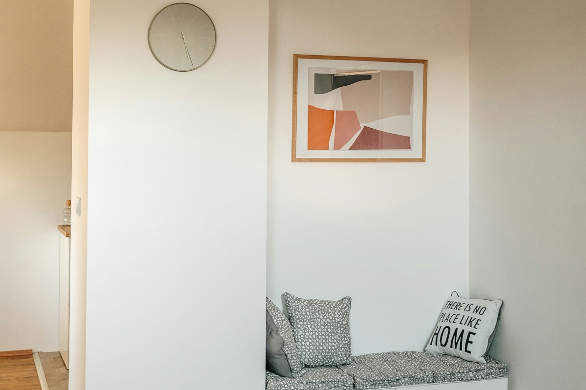 Minimalist living room with uncluttered furniture and a clean statement wall