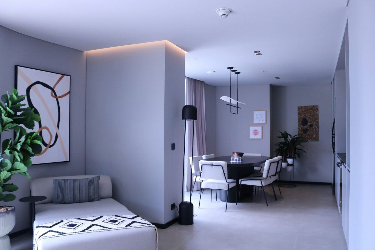 Living room balanced with oversized wall art and minimal furniture styling