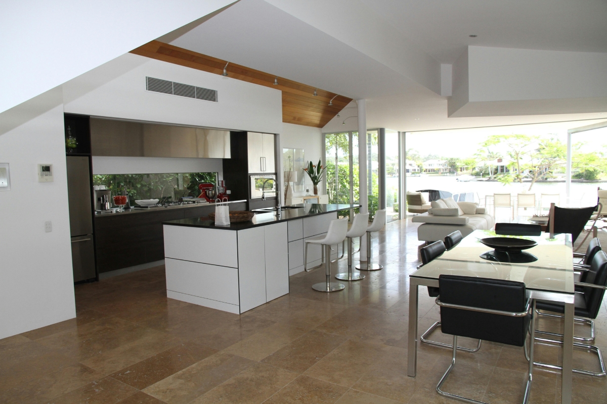 Kitchen accent wall with layered decor including open shelves, plants, and decorative items creating a stylish and functional kitchen wall