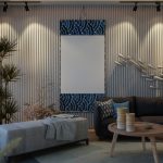 Layered living room styling with textured textiles, wall art, and warm lighting