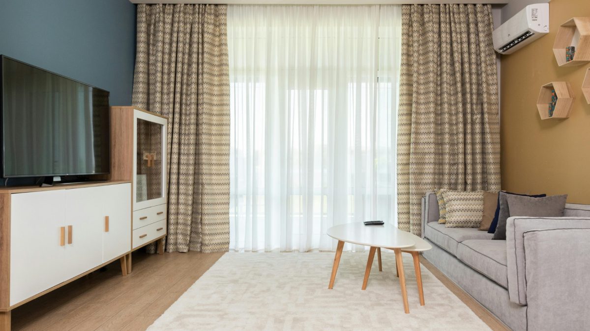 Bright living room with lightweight linen curtains and soft summer colors