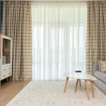 Bright living room with lightweight linen curtains and soft summer colors