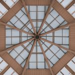 Living room with low ceiling painted white and floor-to-ceiling curtains to feel taller