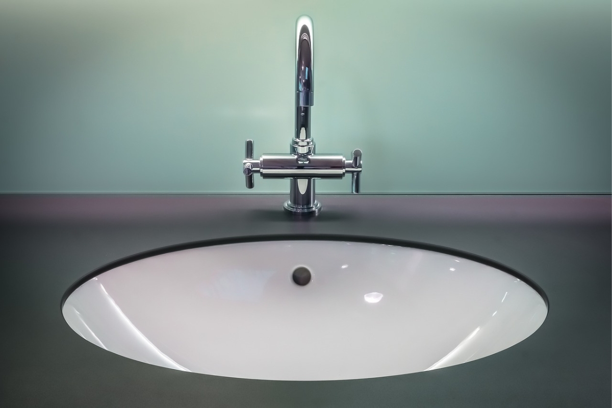Japandi bathroom with matte black minimal cabinet handles