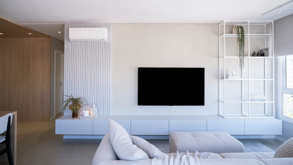 Minimalist living room wall with one large abstract canvas and neutral tones