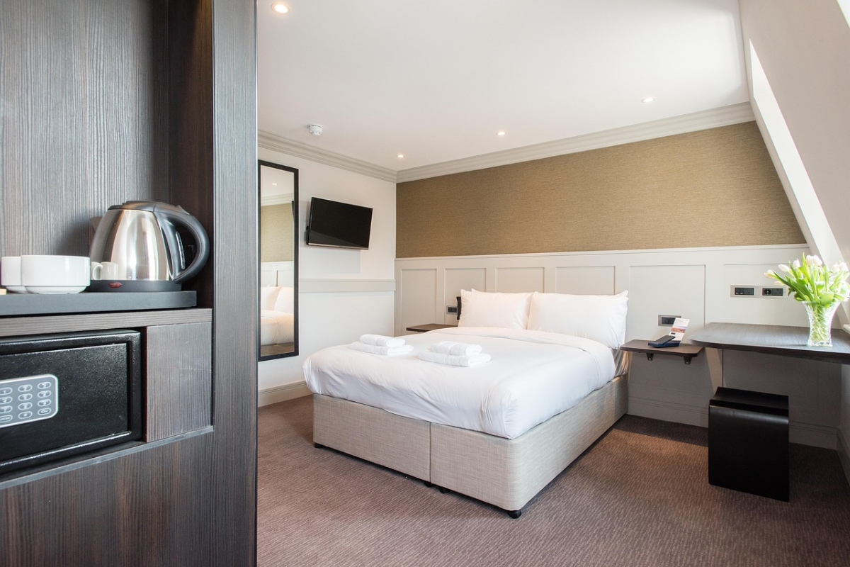 Bedroom accent wall featuring minimalist molding and trim in neutral tones for subtle modern texture and elegance 2026
