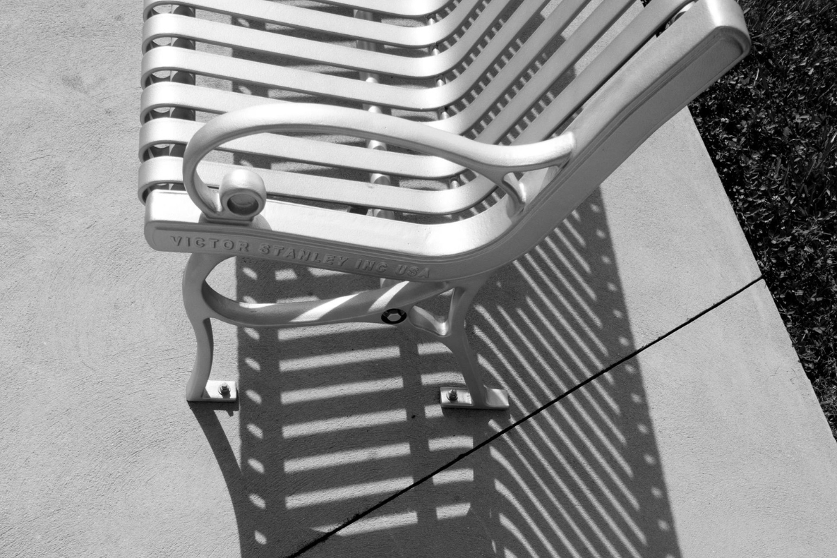 Curved sofa paired with straight-lined rug and console table in modern living roomRounded coffee table styled with rectangular chairs for balanced interior design