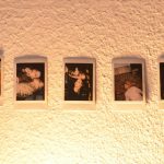 Modern living room wall with personalized family photos in sleek frames