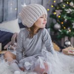 Cozy neutral living room styled with textured pillows and warm lighting after Christmas