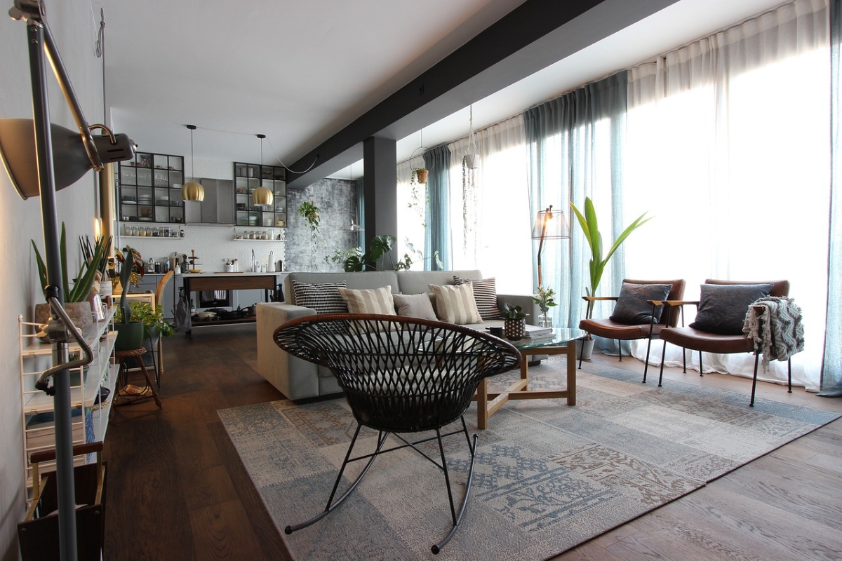 Circular rug anchoring a modern curved dining table and chairs