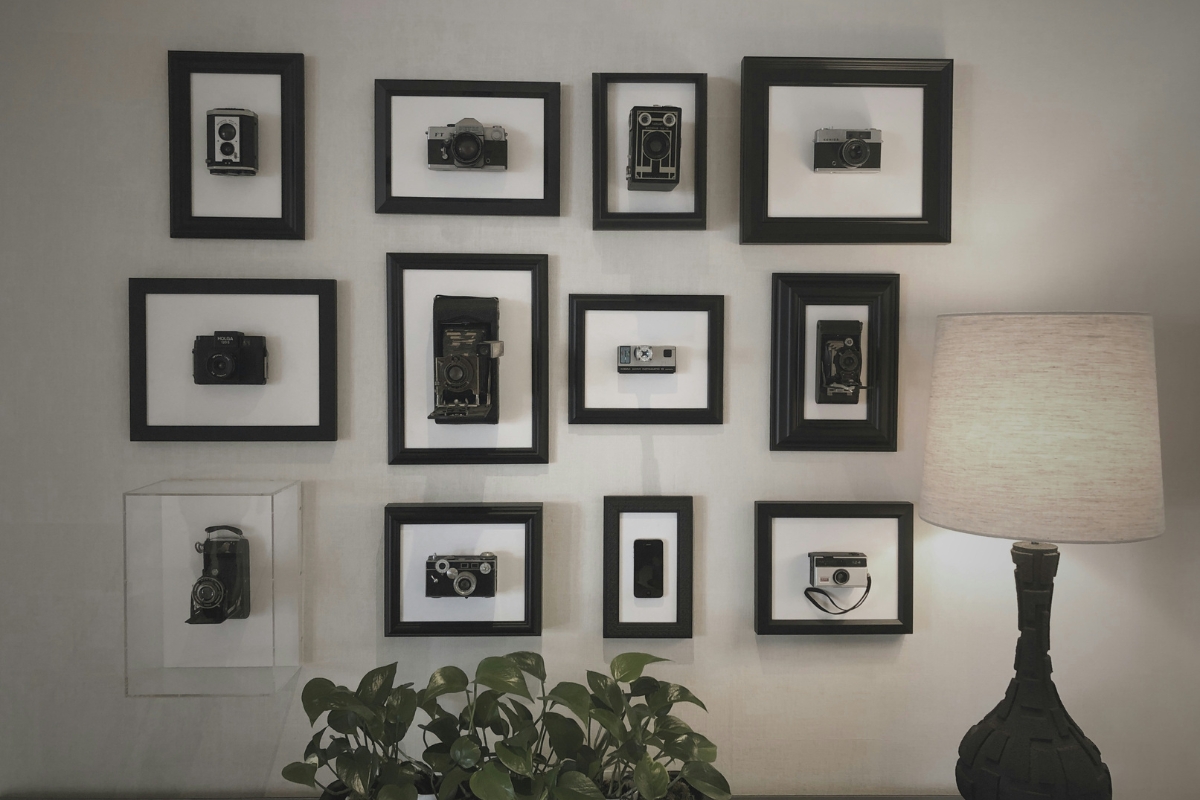 Minimalist frames used for personalized wall decor in a modern living room